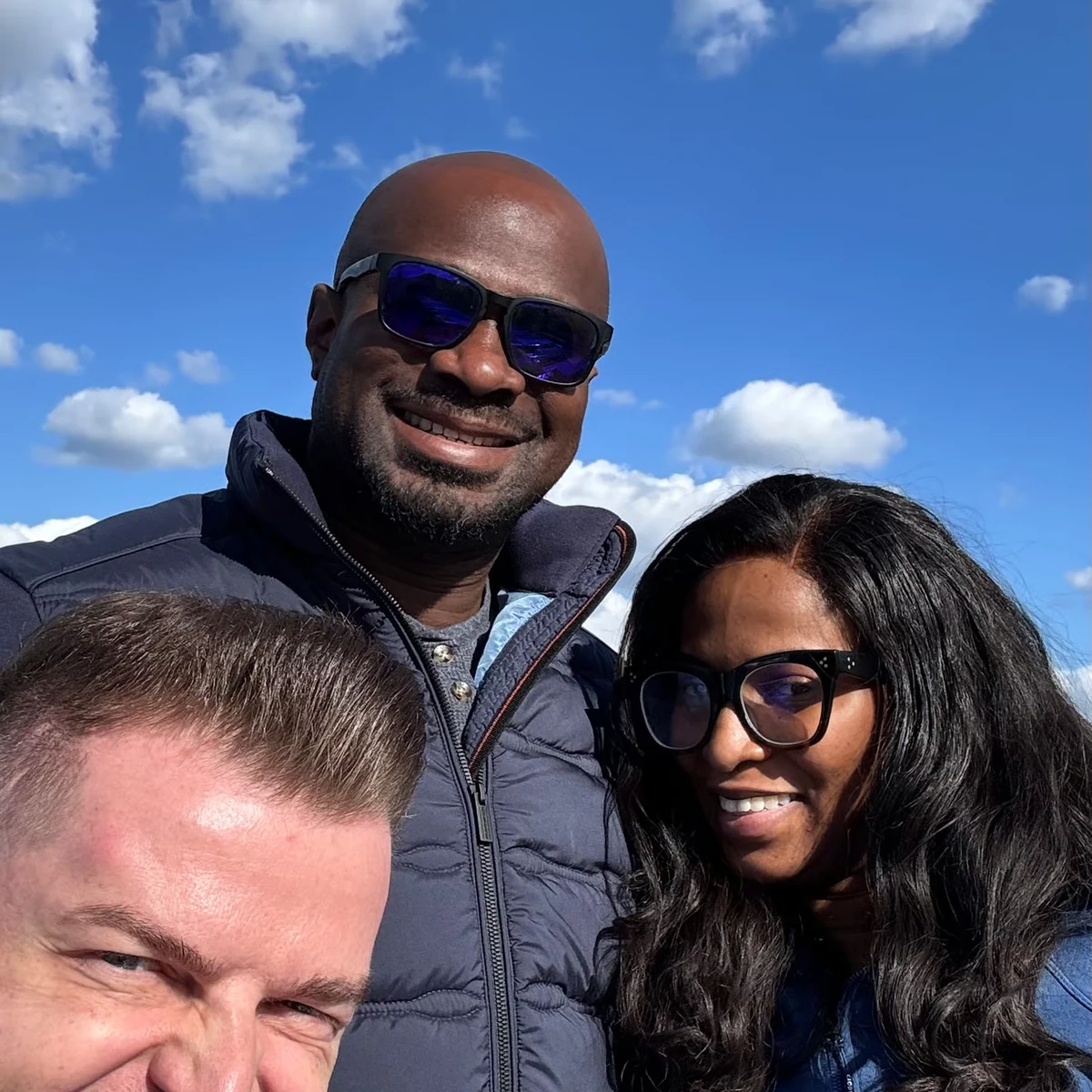 Private tour guests smiling at a scenic Luxembourg viewpoint